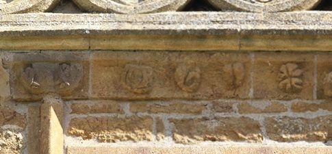 Four external, eroded carvingse