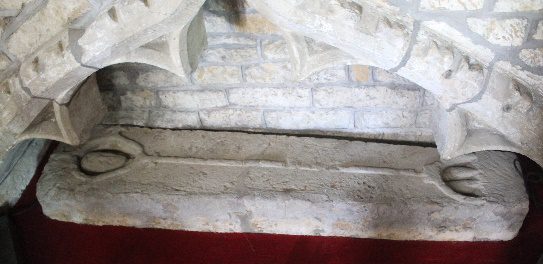 Carving of a figure on a grave slab