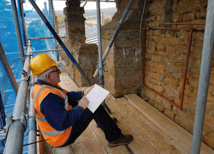 Person sketching stonework