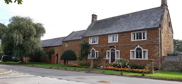 Large farmhouse and attached outbuildings