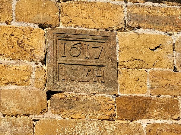 Date stone reading 1617 NH