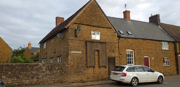 End-terrace building with memorial stone affixed