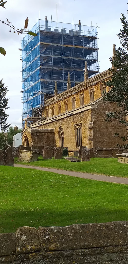 Church restoration - tower shrouded in safety netting