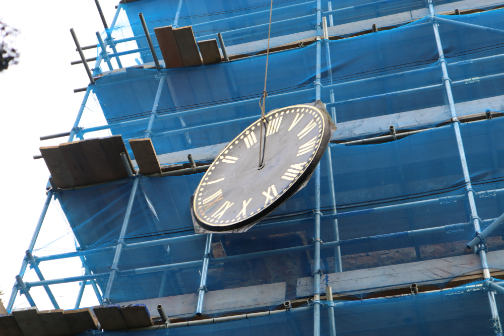 Church restoration - clock being lifted