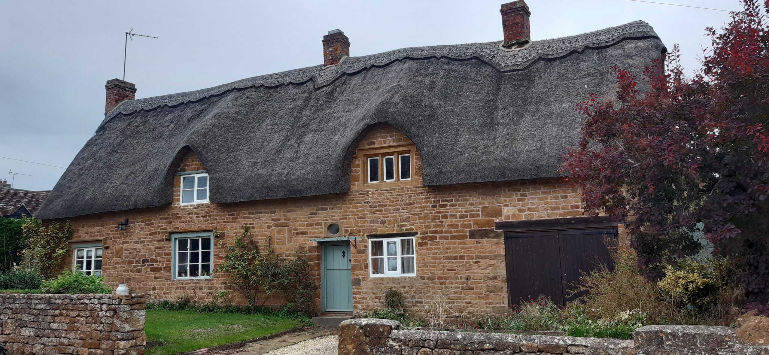 Stone house with thatched roof