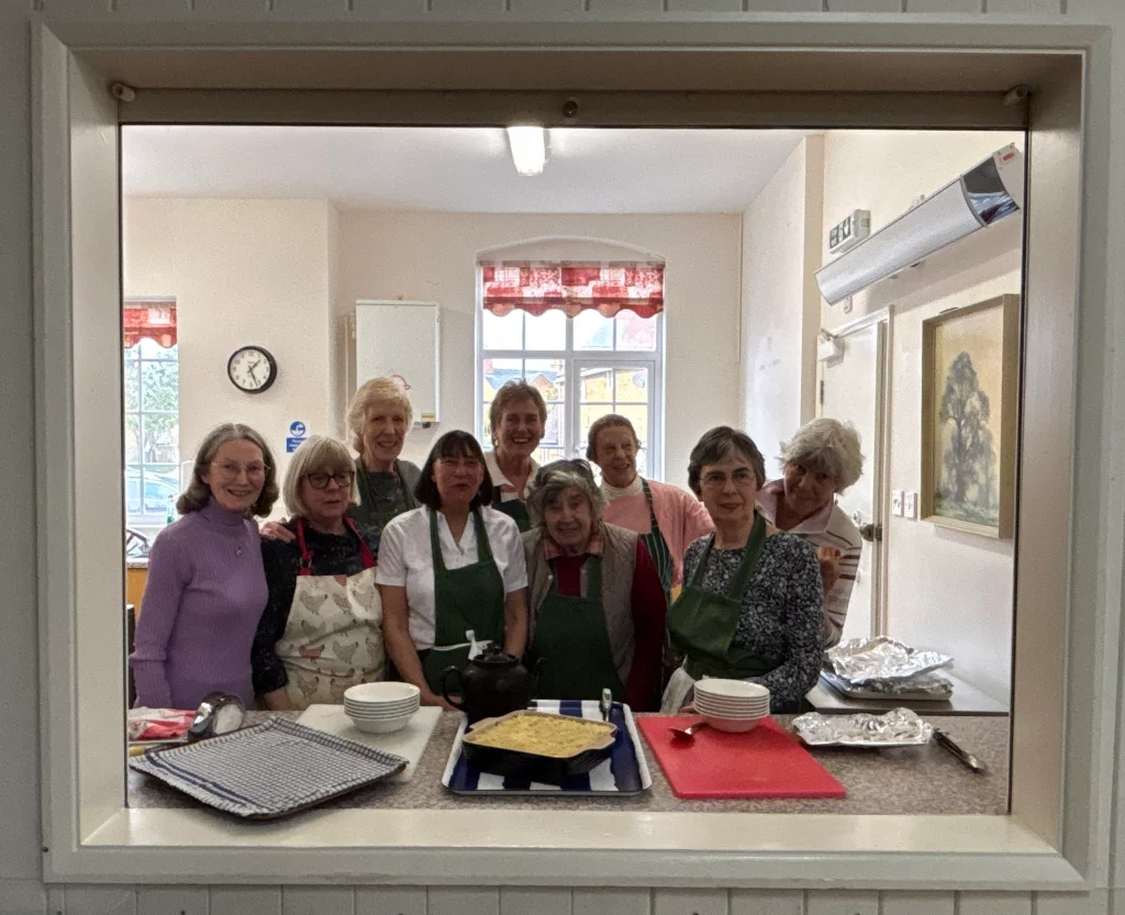 Lunch club team through the hall hatch
