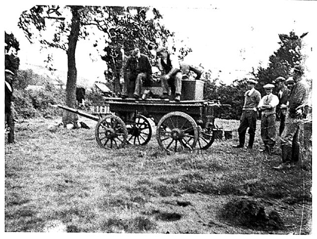 Horse-drawn fire engine with firemen