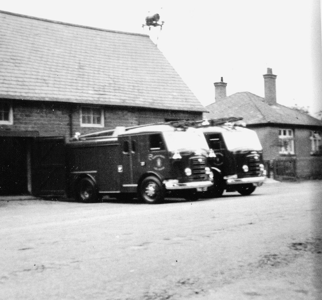 Two fire engines outside a building