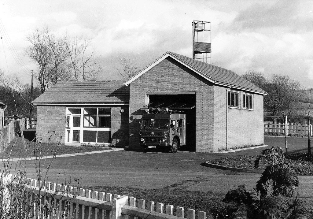 Building with fire engine in entranceway