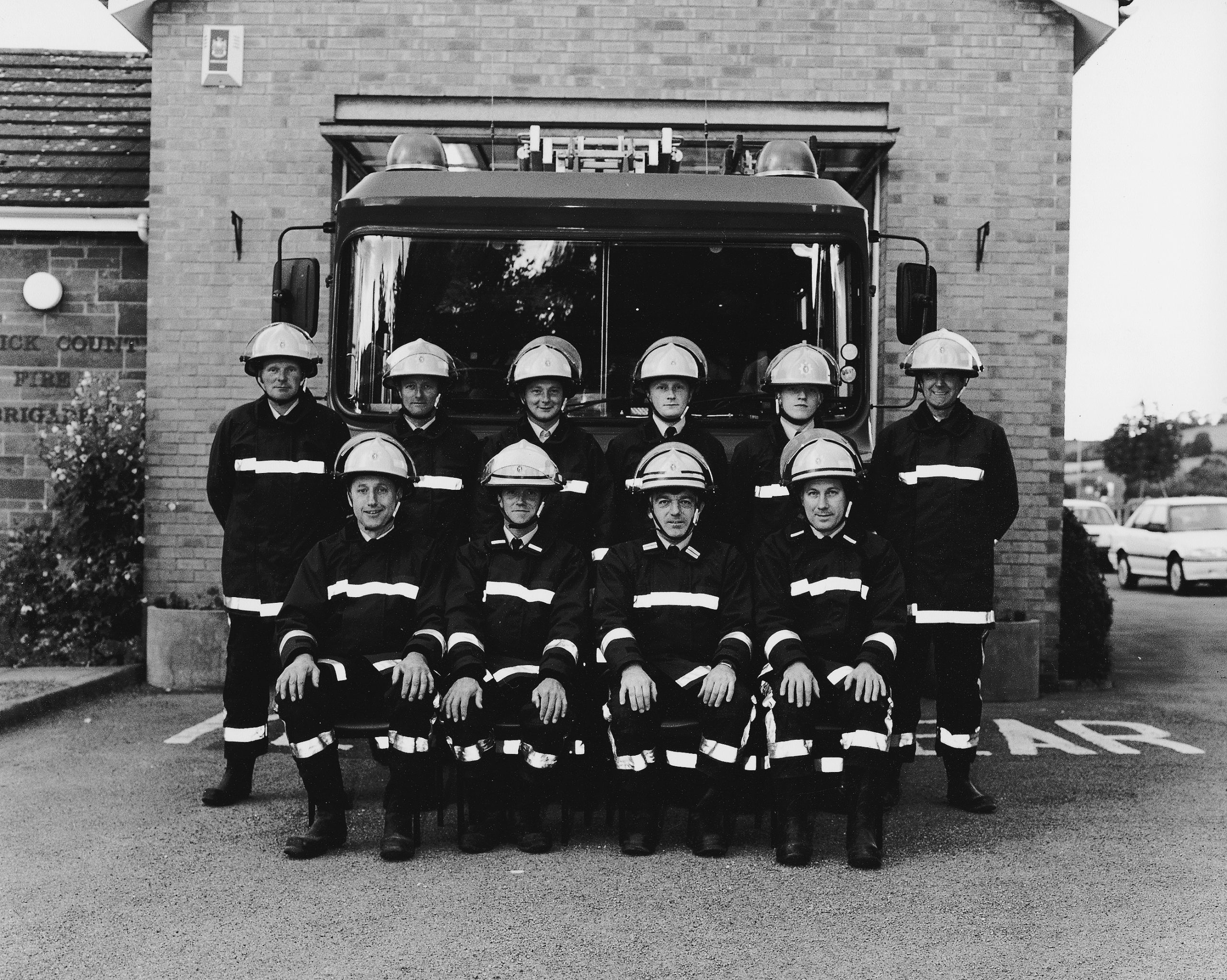 Fire crew in front of fire engine