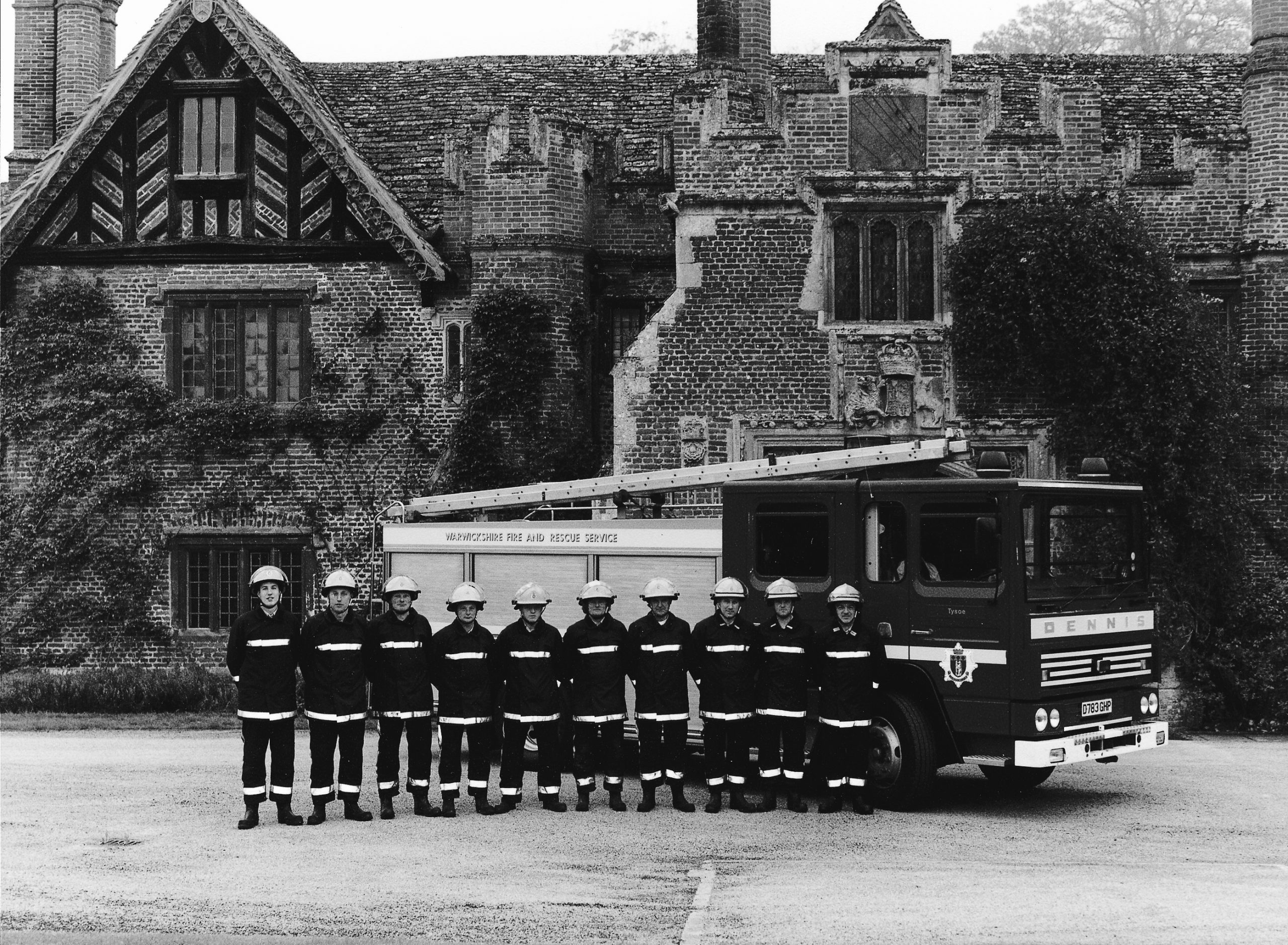 Firemen in front of fire engine